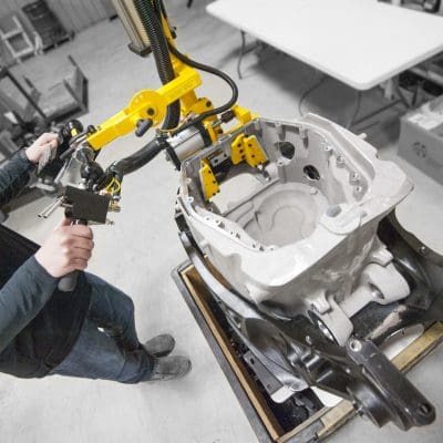 Detail of a GCI manipulator gripping an engine casting