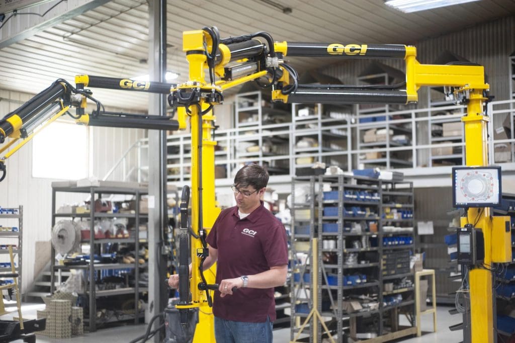 Operator running a GCI 600 Nm capacity linear slide torque reaction arm.