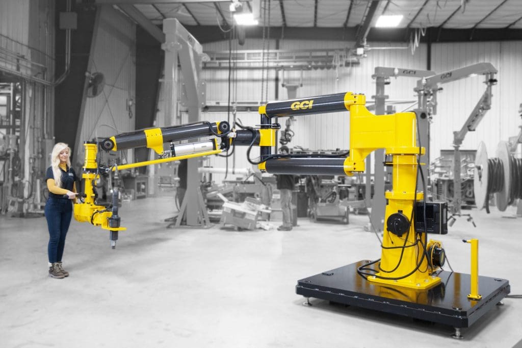 A woman operates a GCI torque reaction arm with a 3000 Nm tool