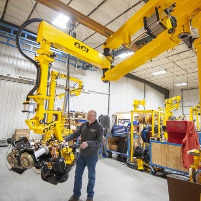 Operator lifts 250 lb refrigerator parts with a GCI industrial manipulator