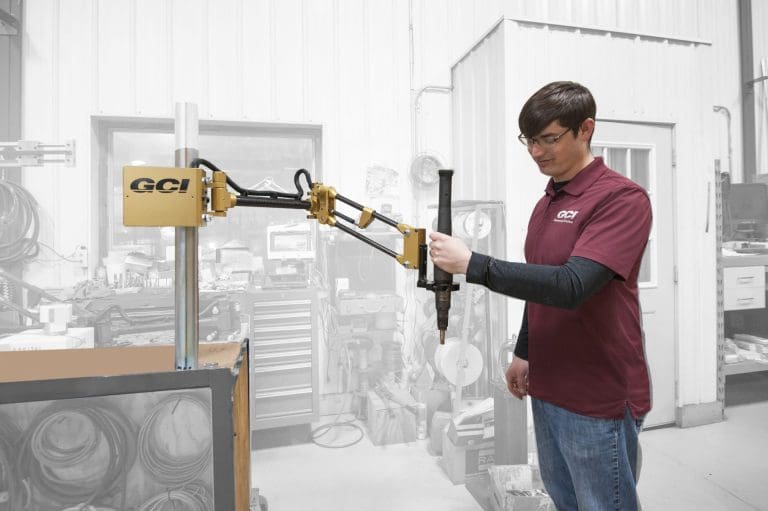 Operator running a 100 Nm carbon fiber GCI torque reaction arm.