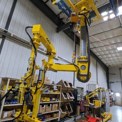 Overhead stacker tire manipulator