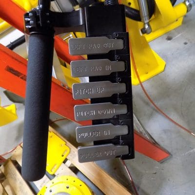 Left controls for gripper, powered pitch, and CoG shift