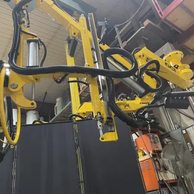 Industrial manipulator arm with a custom tire handler