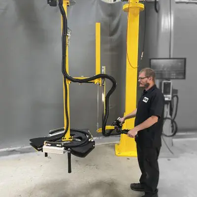 GCI Engineered Solutions operator showing their custom tire manipulator in use
