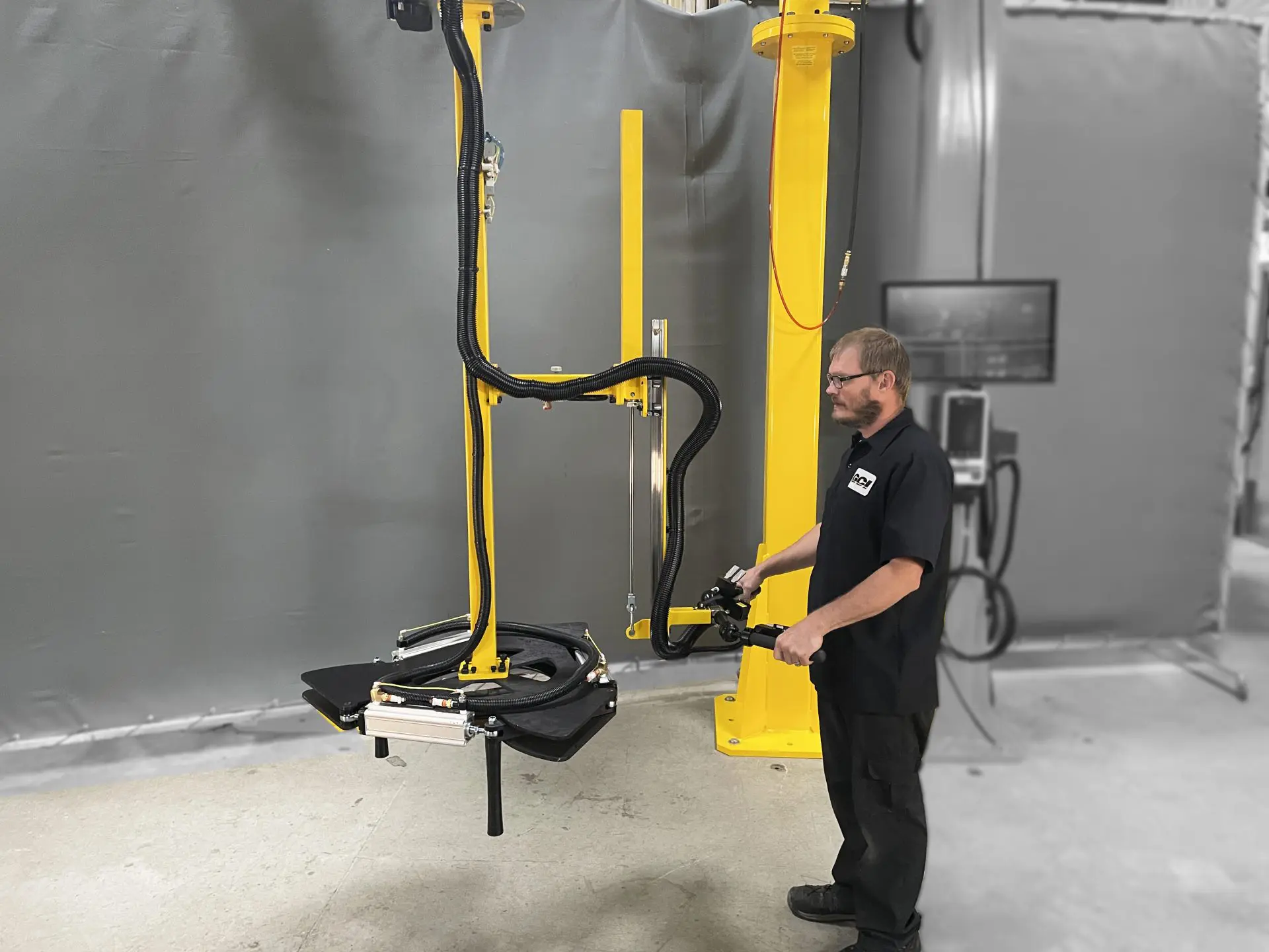 GCI Engineered Solutions operator showing their custom tire manipulator in use