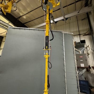 overhead mounted torque tube for automotive assembly