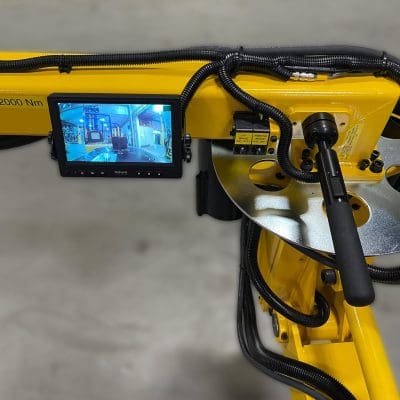 A monitor by the controls gives the operator a good view to position the tool