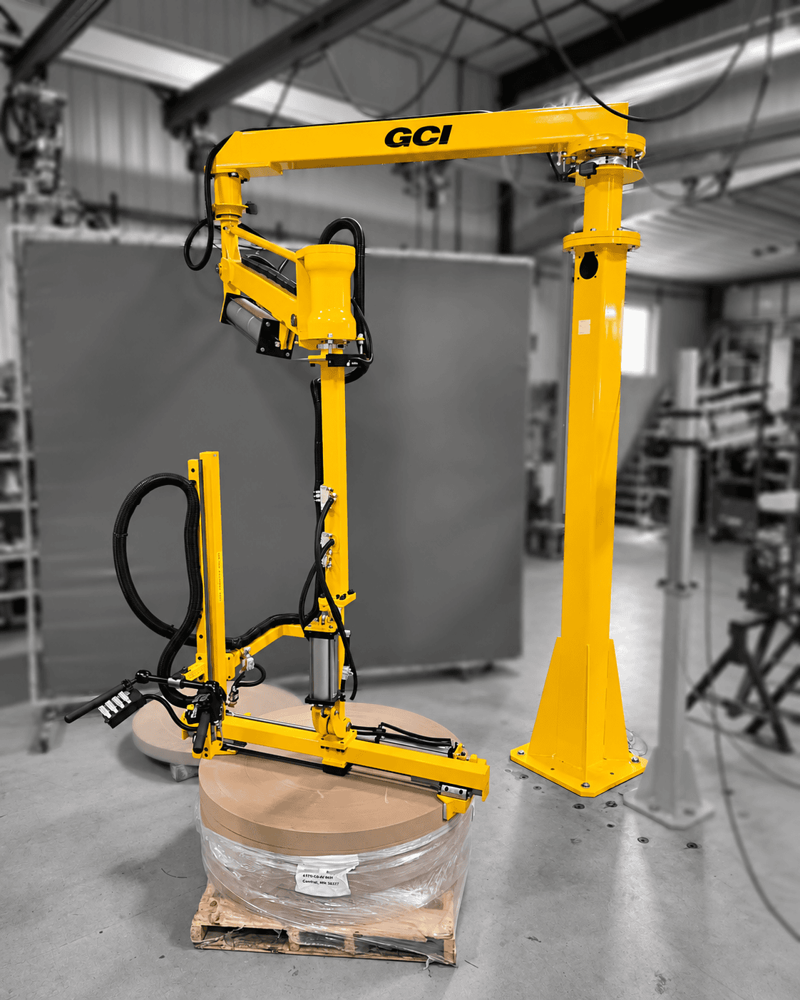 Paper roll handling manipulator arm